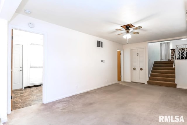 carpeted empty room featuring ceiling fan