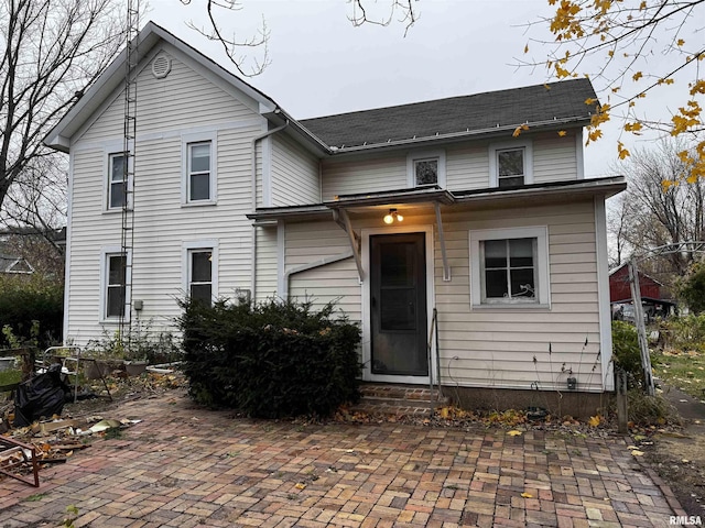 front facade with a patio area