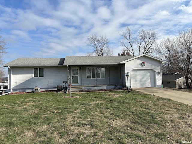 ranch-style house featuring covered porch, a front yard, and a garage