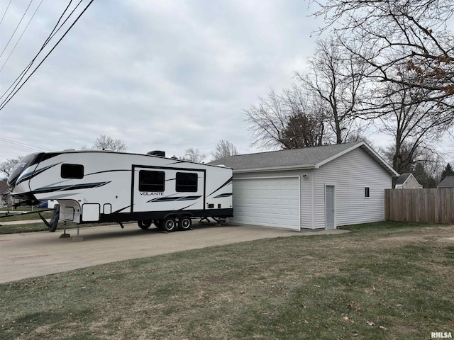 garage featuring a lawn