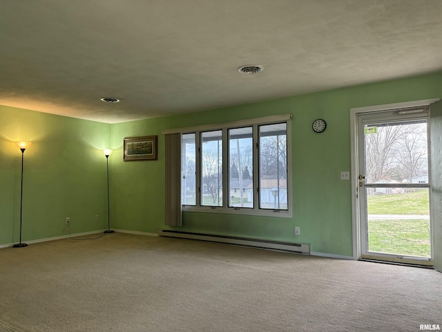 empty room featuring carpet and a baseboard radiator