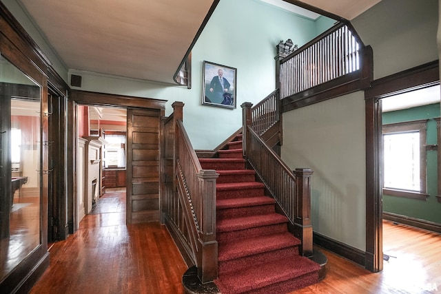 stairway featuring hardwood / wood-style floors