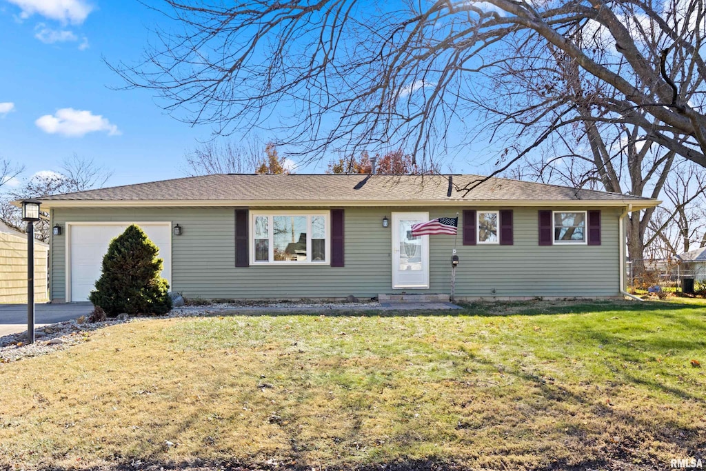 single story home featuring a garage and a front yard