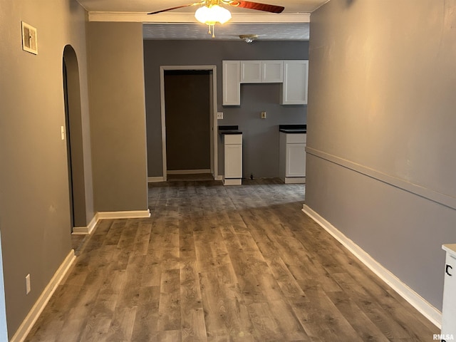 hallway featuring hardwood / wood-style flooring and ornamental molding