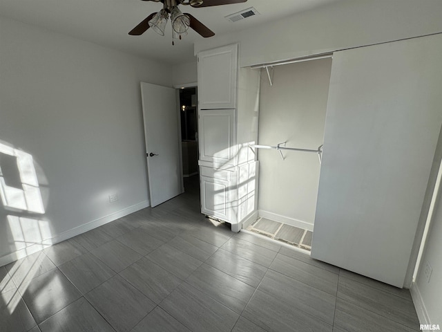 unfurnished bedroom with a closet and ceiling fan