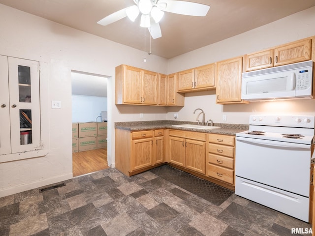 kitchen with white appliances, ceiling fan, sink, light brown cabinets, and dark hardwood / wood-style floors