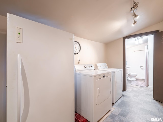 laundry room with separate washer and dryer