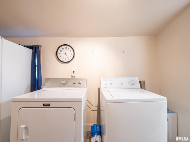 laundry area with separate washer and dryer