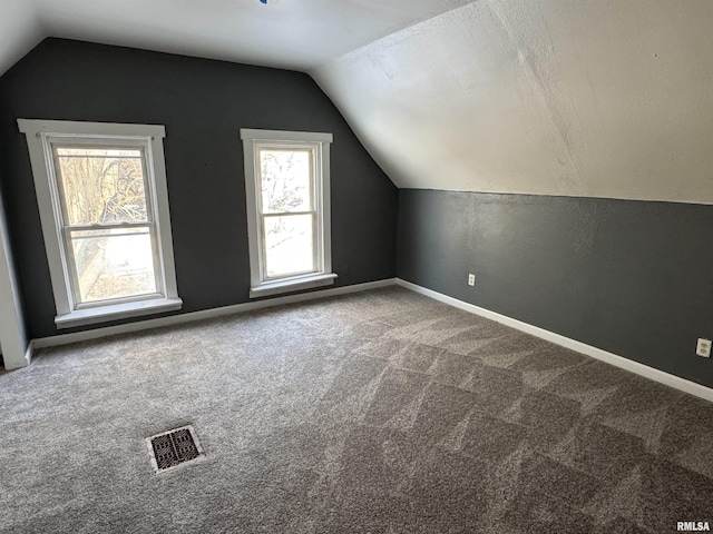 bonus room featuring carpet and lofted ceiling