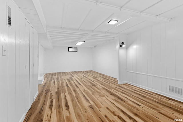 basement with wood-type flooring