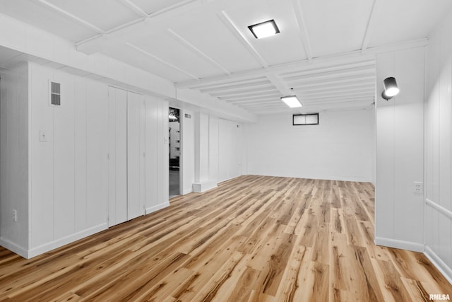 basement featuring light wood-type flooring