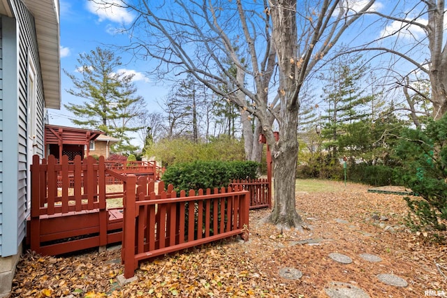 view of yard featuring a wooden deck