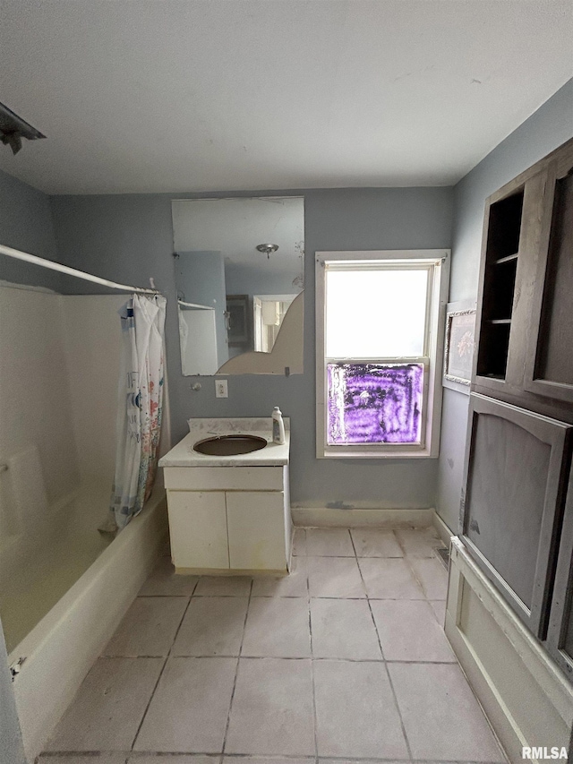 bathroom featuring shower / bath combination with curtain, vanity, and tile patterned floors