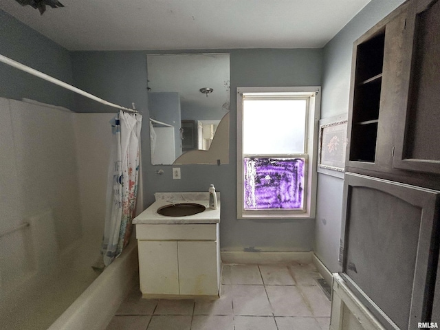 bathroom with shower / bathtub combination with curtain, tile patterned flooring, and vanity