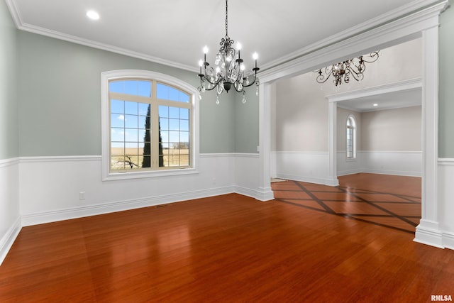 unfurnished dining area featuring visible vents, a wainscoted wall, ornamental molding, wood finished floors, and recessed lighting