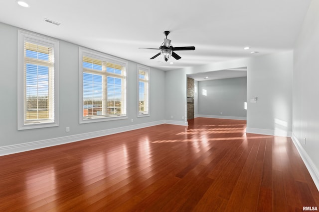 spare room with ceiling fan, baseboards, wood finished floors, and recessed lighting