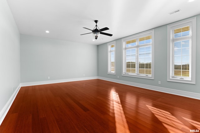 spare room with baseboards, visible vents, ceiling fan, wood finished floors, and recessed lighting