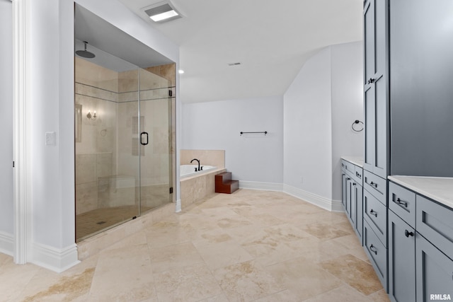 full bathroom with a garden tub, visible vents, a stall shower, vanity, and baseboards