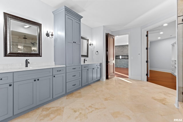 full bath with recessed lighting, baseboards, and vanity