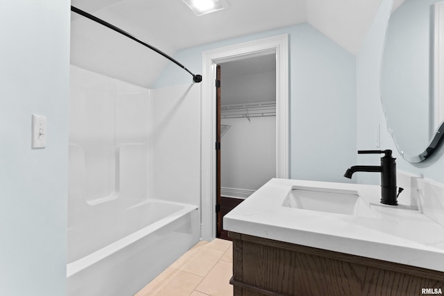 full bath with vaulted ceiling, visible vents, bathing tub / shower combination, and vanity