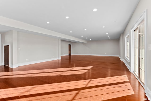 unfurnished living room featuring baseboards, wood finished floors, and recessed lighting