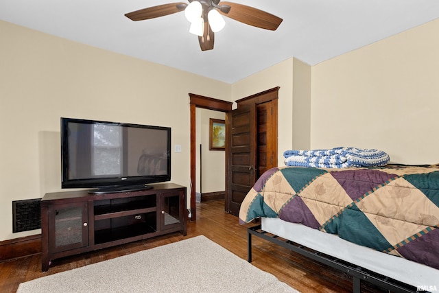 bedroom with hardwood / wood-style flooring and ceiling fan