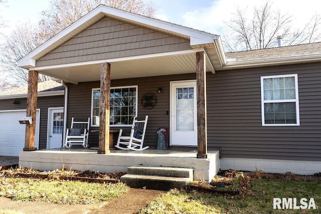 view of front of home featuring a garage and covered porch