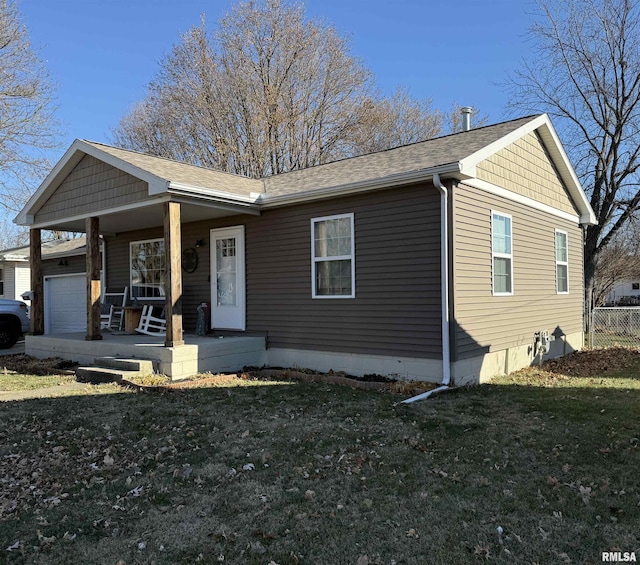 ranch-style house featuring a porch and a front yard