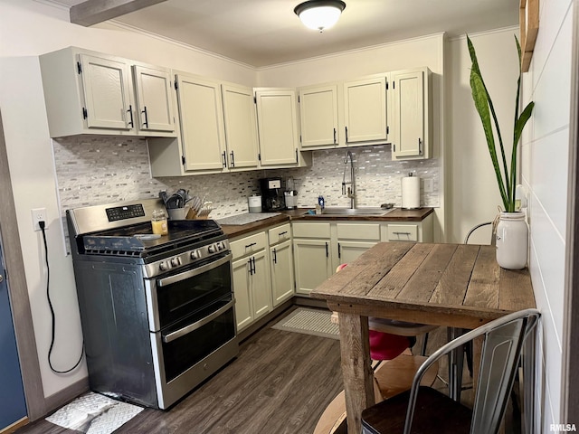 kitchen with gas stove, decorative backsplash, sink, and dark wood-type flooring