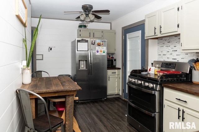 kitchen with ceiling fan, dark hardwood / wood-style floors, backsplash, appliances with stainless steel finishes, and ornamental molding