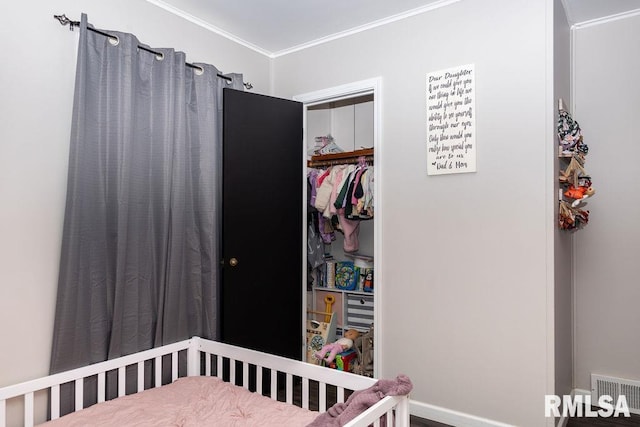 bedroom featuring a closet and ornamental molding