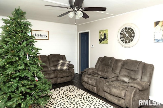 living room featuring ceiling fan, wood-type flooring, and ornamental molding