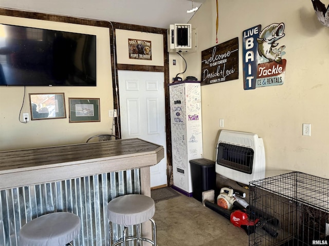 kitchen featuring carpet flooring and heating unit