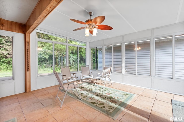 sunroom with vaulted ceiling, ceiling fan, and a healthy amount of sunlight