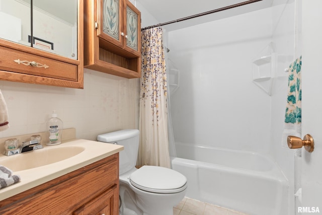 full bathroom featuring tile patterned floors, vanity, toilet, and tasteful backsplash