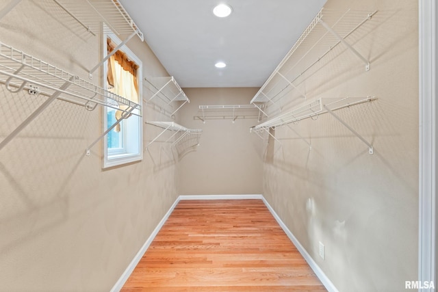 walk in closet featuring hardwood / wood-style floors