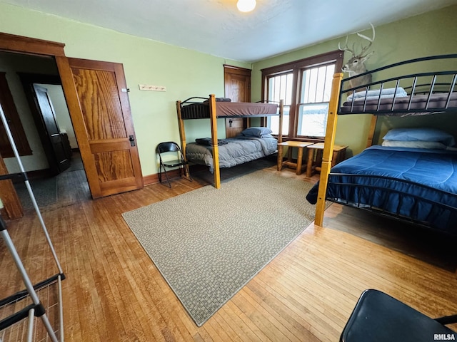 bedroom with hardwood / wood-style flooring