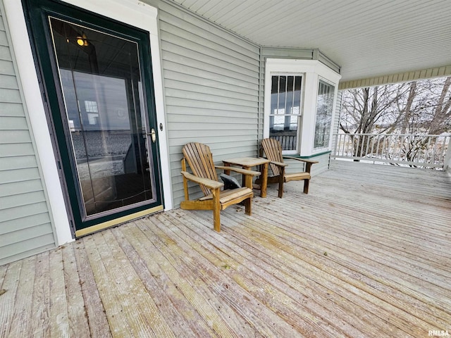 wooden terrace featuring a porch