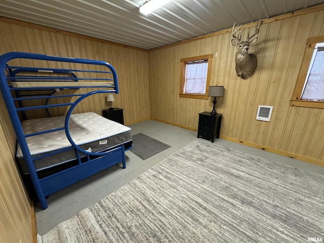 bedroom with wooden walls