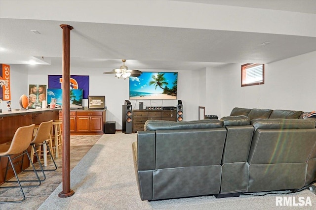 carpeted living room with ceiling fan