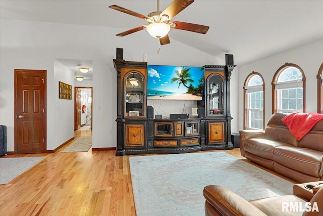 living room featuring wood-type flooring, ceiling fan, and lofted ceiling