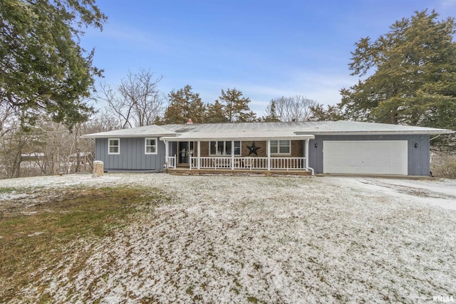 ranch-style house with covered porch and a garage