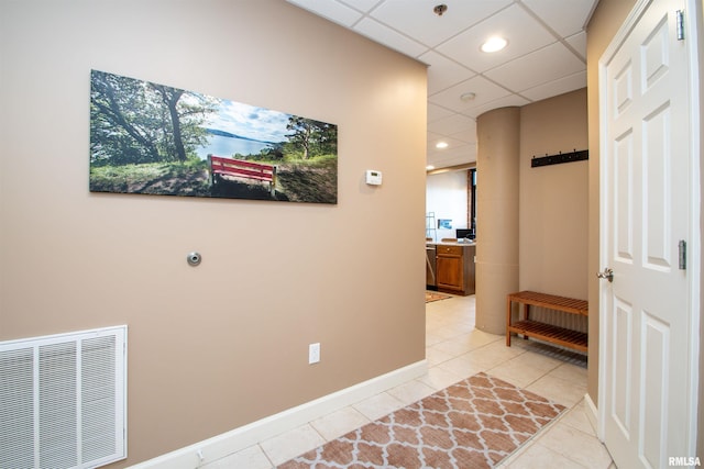 hall with light tile patterned flooring