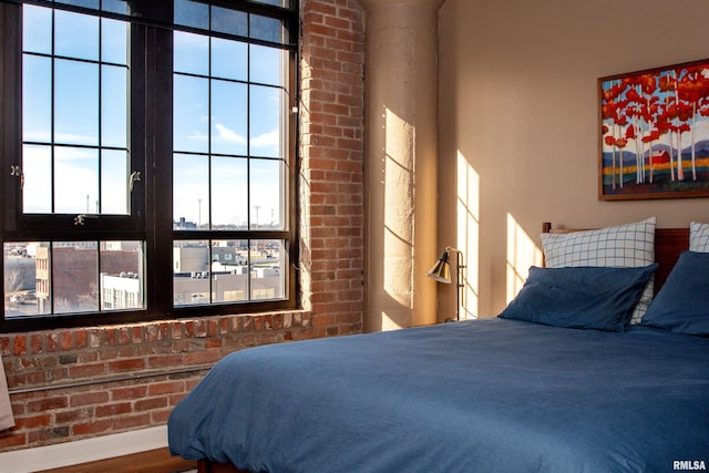 bedroom with hardwood / wood-style flooring