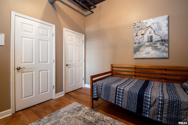 bedroom with hardwood / wood-style flooring