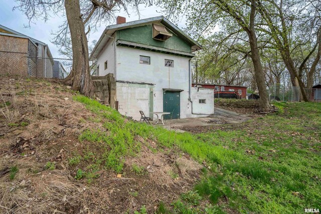 view of outbuilding with fence