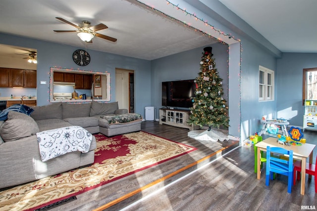 living room featuring hardwood / wood-style floors and ceiling fan