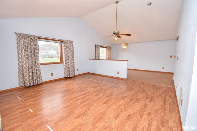 unfurnished room with ceiling fan, light hardwood / wood-style floors, and vaulted ceiling