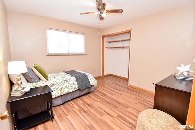 bedroom with light wood-style floors, a closet, baseboards, and a ceiling fan