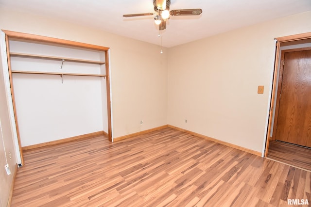 unfurnished bedroom featuring ceiling fan, a closet, and light hardwood / wood-style floors